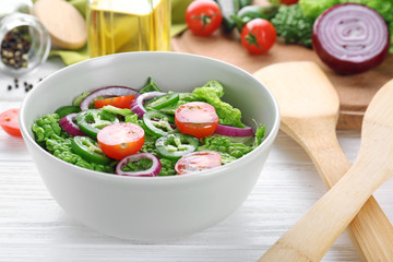 Delicious vegetable salad on table