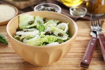Delicious vegetable salad on table