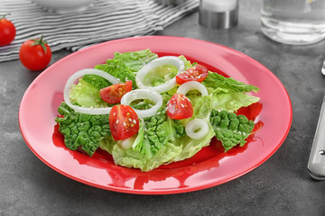 Delicious vegetable salad on table