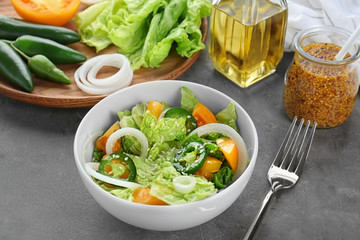 Delicious vegetable salad on table