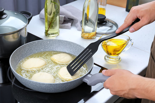 Man Cooking Pancakes On Frying Pan