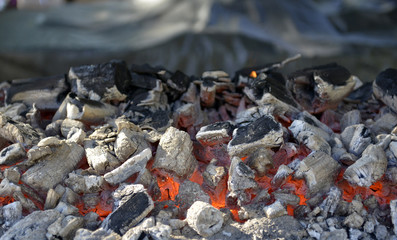 BBQ Grill Pit With Glowing And Flaming Hot Charcoal Briquettes,