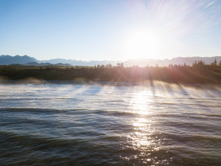 Beautiful aerial seascape view of Pacific Ocean Coast during a vibrant summer sunrise. Taken near Tofino, Vancouver Island, British Columbia, Canada.