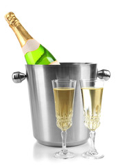 Bottle of champagne in bucket and glasses of champagne, isolated on white
