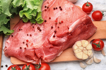 Fresh raw meat on wooden board