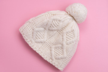 white knitted hat on pink background
