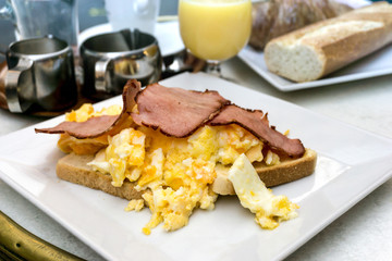 Breakfast with Egg and ham on table
