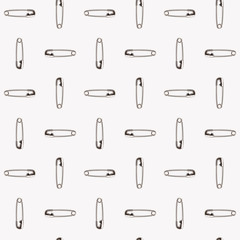 An alternating pattern of safety pins on a white background. - obrazy, fototapety, plakaty