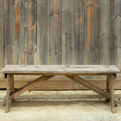 wooden chair with old wood wall.