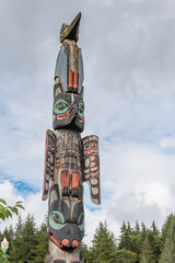 Totem pole with raven and eagle and bear