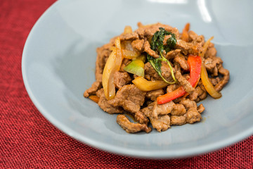 wok fried chicken stir fry with sweet peppers and chinese vegetables
