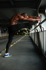 Full length portrait of a motivated young muscular african sportsman