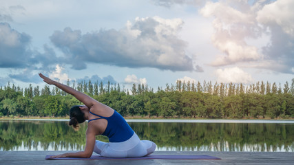 Asian woman practicing yoga pose