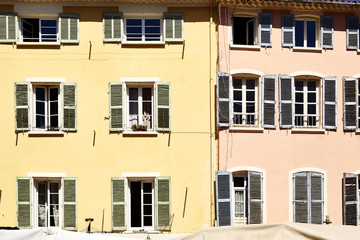Fototapeta na wymiar Coloured facades in a Street of Hyères - Provence