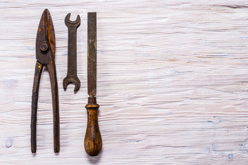 Antique constuctor tools on wooden background
