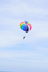 The sky parachute has a blue backdrop background.