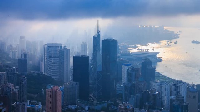 Aerial Silhouette Hong Kong Cityscape On Cloudy Day Over 4K Time Lapse (pan up)