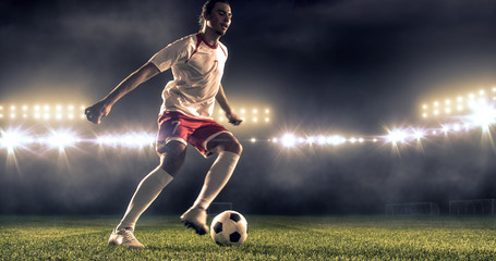 Soccer player kicks the ball on the soccer stadium. He wear unbranded sports clothes. Stadium and crowd made in 3D. © haizon