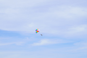 Fototapeta na wymiar The sky parachute has a blue backdrop background.