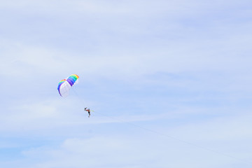 The sky parachute has a blue backdrop background.