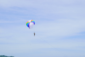 The sky parachute has a blue backdrop background.