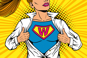 Pop art female superhero. Young sexy woman dressed in white jacket shows superhero t-shirt with W sign means Woman on the chest flies smiling. Vector illustration in retro pop art comic style. - 174527470
