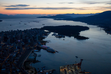 Aerial view of Downtown Vancouver, BC, Canada, taken during the night after a colorful sunset.