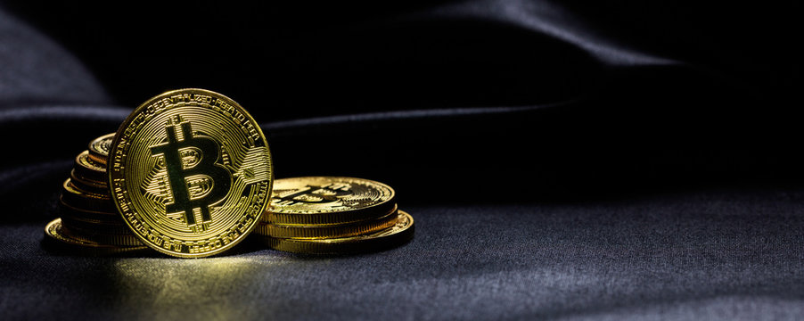 Bitcoins stack on black background