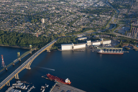 Aerial View Of Industrial Sites And Ironworkers Memorial Second Narrows Crossing In North Vancouver, British Columbia, Canada.