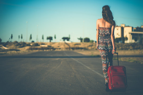  Woman Dragging A Suitcase