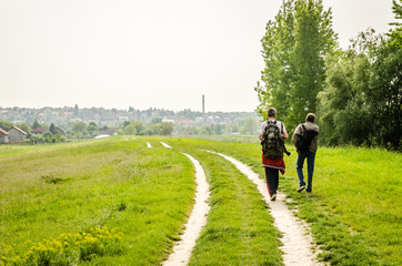 Fototapeta premium Two men walk through 