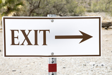 White exit sign with arrow