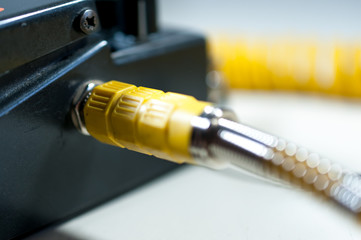 Yellow connected guitar cable to the distorter.
