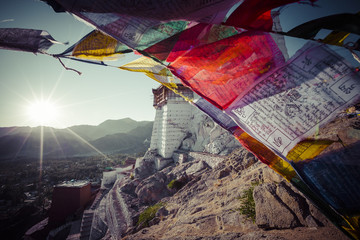 Prayer tibetan flags near the Namgyal Tsemo Monastery in Leh, Ladakh - obrazy, fototapety, plakaty