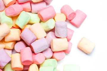 Colorful mini marshmallows isolated on white background, macro. Fluffy marshmallows texture and pattern. High Resolution image