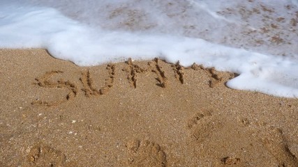 Sea wave wash away written summer word