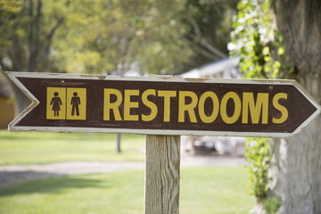 Restroom sign with arrow 