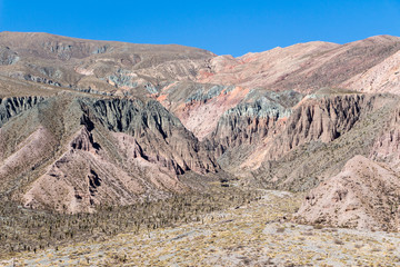 Purmamarca, hills of several colors among which predominates red, violet, purple, pink, orange, brown