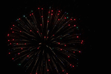 Fototapeta na wymiar Festive fireworks in the dark sky