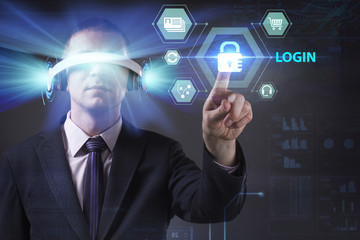 Business, Technology, Internet and network concept. Young businessman working in virtual reality glasses sees the inscription: Login