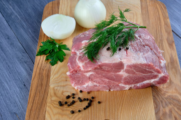 Raw meat on wooden Board
