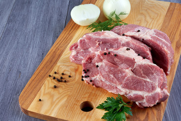 Raw meat on wooden Board