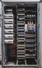 Voltage switchboard with circuit breakers. Electrical background. Electrical switch panel of switchgear room at power plant.