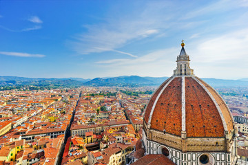 Fototapeta na wymiar View of the dome of Florence Cathedral and the Florence city in the background on a sunny day. 