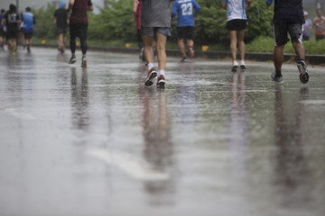 Marathon runners on the road the day it rained.