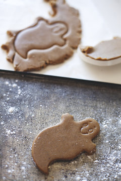 Gingerbread ghost cookie awaits baking for Halloween