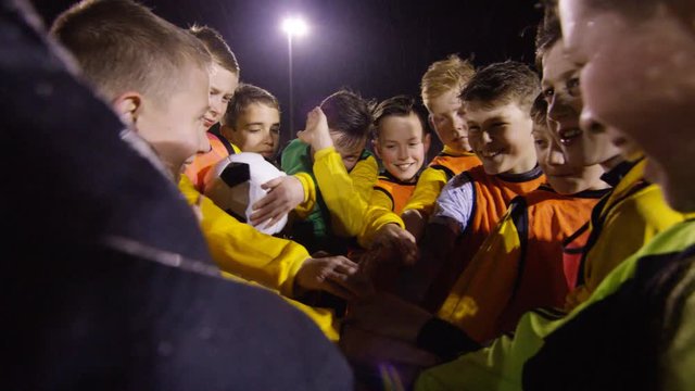 March 2016. British youth soccer team training huddle for a team talk