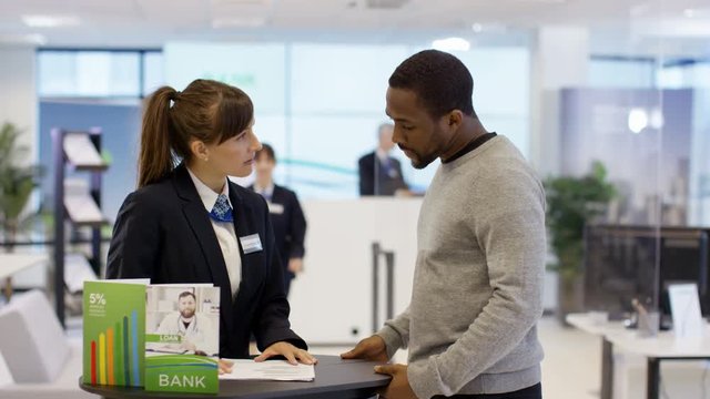  Customer waits to meet with financial adviser in modern bank