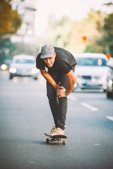 The skateboard rider on the street exhausted of riding skate