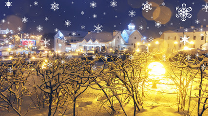 Xmas background. New Year's fairy tale in night city. Falling snowflakes and shining lanterns of Christmas city. Theme of Christmas and New Year